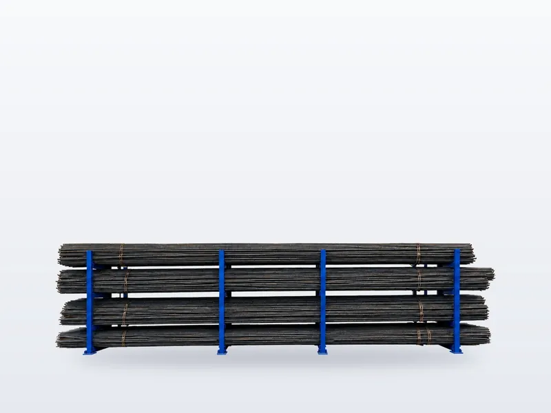Yard में rack पर रखे TMT Saria reinforcement bars