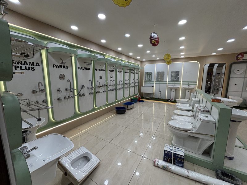 Shower panels and wall mixers on the bathroom fittings display at Balaji Mart, Bikapur