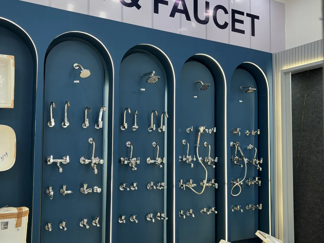 Chrome faucets, taps and mixers mounted across the bathroom fittings wall at Balaji Mart, Bikapur, Ayodhya