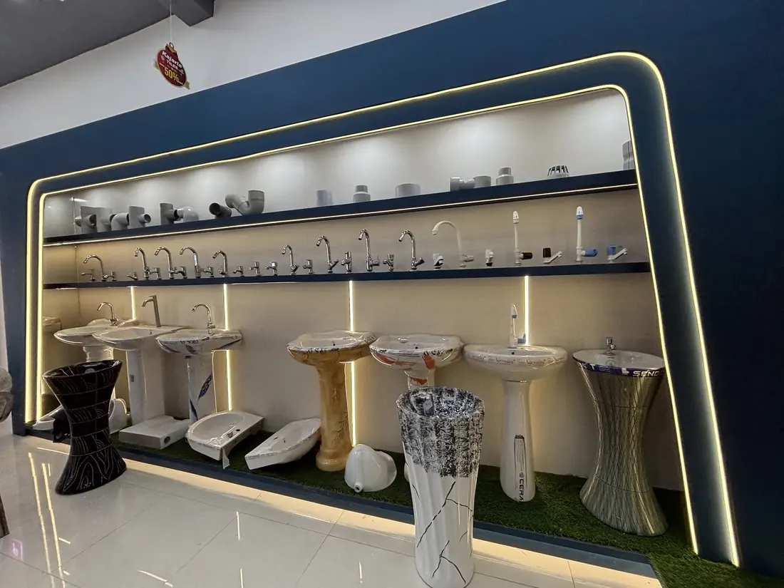 Pedestal wash basins fitted with chrome taps on the sanitaryware display counter at Balaji Mart, Bikapur