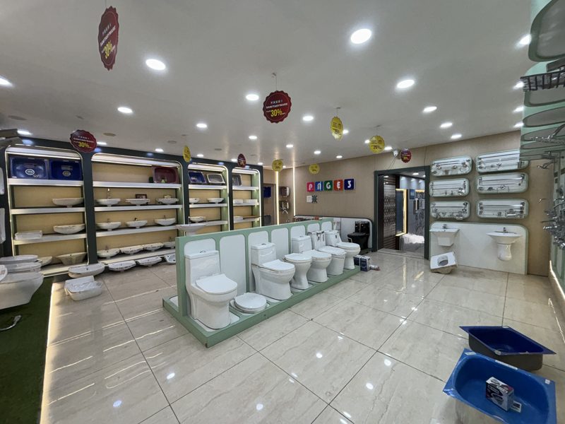 Sanitaryware section with western toilets and wash basins at Balaji Mart, Bikapur